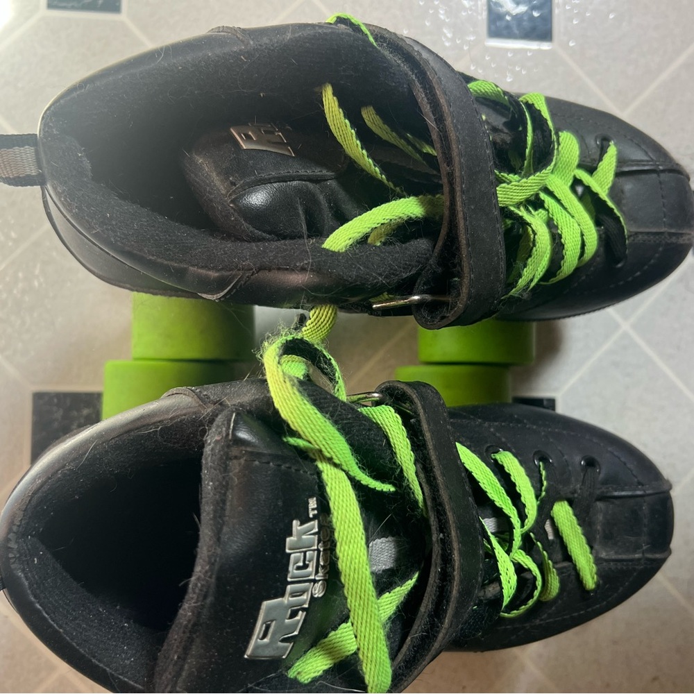 Black and Green Speed Roller Skates with Neon Accents